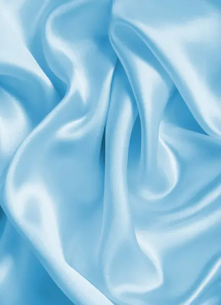 Ομαλή κομψό μπλε μετάξι ή υφή υφάσματος σατέν πολυτελείας, όπως abstra — Φωτογραφία Αρχείου