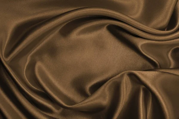 Glatte, elegante braune Seiden- oder Satin-Textur als abstrakter Hintergrund — Stockfoto