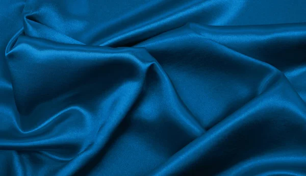 Soepele elegante blauwe zijde of Satijn luxe doek textuur als abstra — Stockfoto