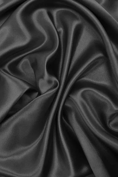 Гладка елегантна темно-сіра шовкова або атласна текстура як абстрактний фон — стокове фото