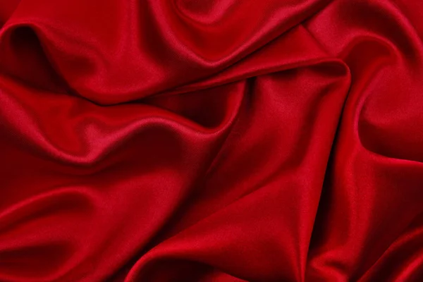 Glatte, elegante Textur aus roter Seide oder luxuriösem Satin als abstrakte Textur — Stockfoto