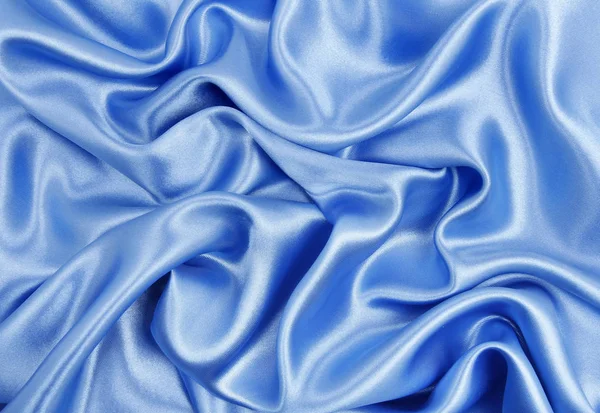 Texture lisse élégante en soie bleue ou tissu de luxe satiné comme abstra — Photo