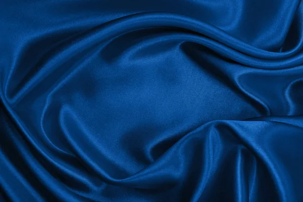 Sima, elegáns kék selyem, vagy szatén luxus ruhával a textúra a abstra — Stock Fotó