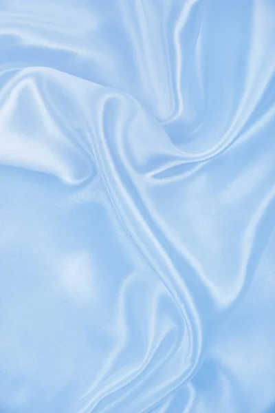 Гладкий элегантный синий шелк или атласная текстура в качестве фона — стоковое фото
