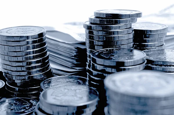 Russian money rubles coins and banknotes on a light background.