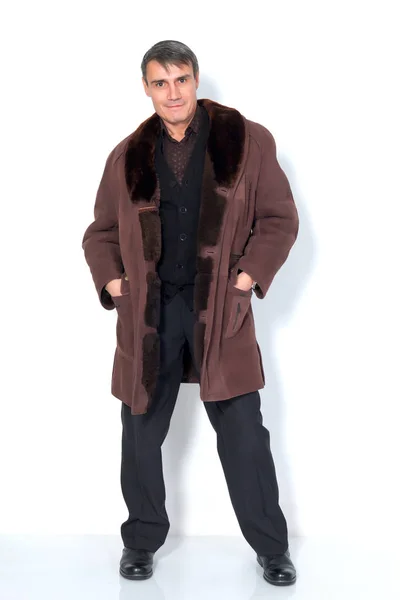 A man in a sheepskin coat. — Stock Photo, Image