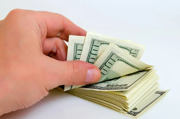 Many hundred dollar bills in his hand. — Stock Photo, Image
