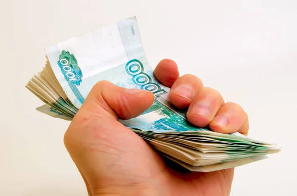 Many rubles in hand. — Stock Photo, Image