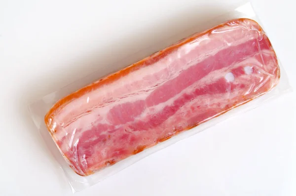 Bacon in vacuum packing. — Stock Photo, Image