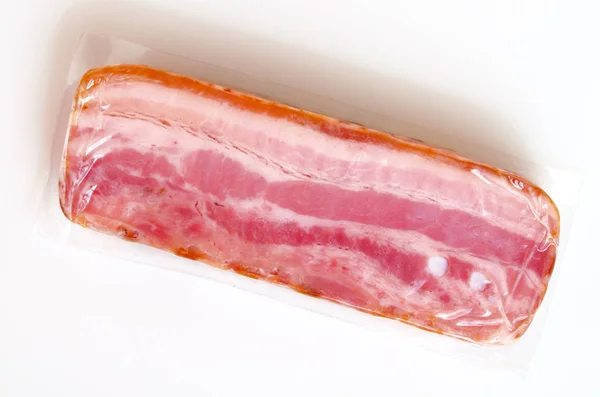 Bacon in vacuum packing. — Stock Photo, Image