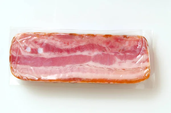 Bacon in vacuum packing. — Stock Photo, Image