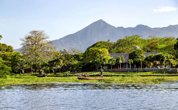 CENTRAL AMERICA, NICARAGUA, MAY, 2014 - Two men are fishing in Lake Nicaragua or Lake Cocibolka the tenth largest fresh water lake in the world and second largest in Central America