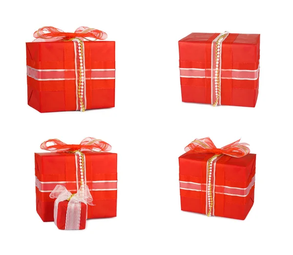 Conjunto de cajas de regalo navideñas decoradas con arcos y cintas — Foto de Stock