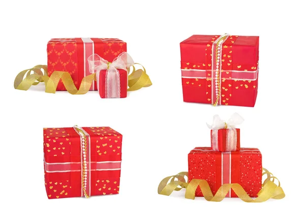 Conjunto de cajas de regalo navideñas decoradas con arcos y cintas — Foto de Stock