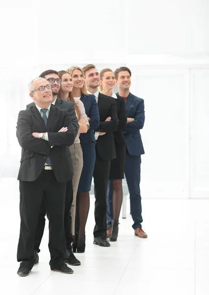 Successful team of staff standing in a row — Stock Photo, Image