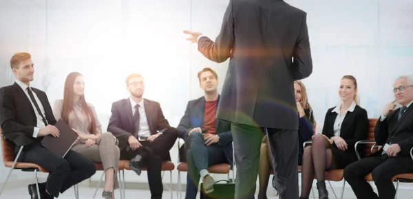 Member of the business team asks a question to the speaker at a — Stock Photo, Image