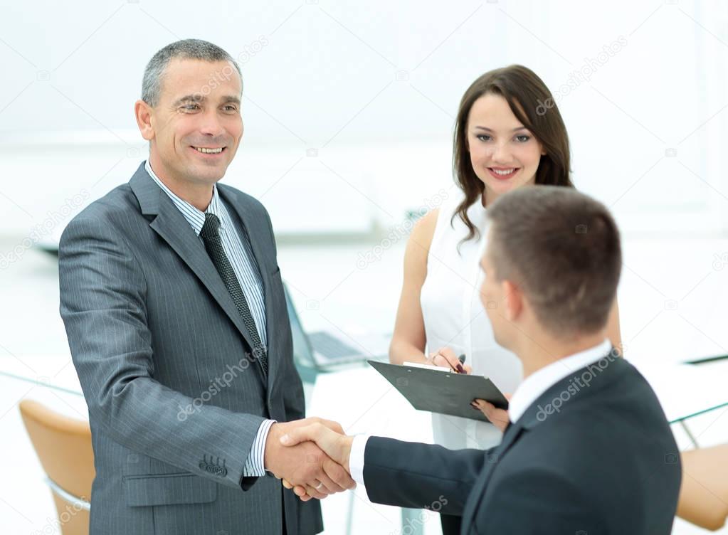 Successful handshake of business men before signing a contract