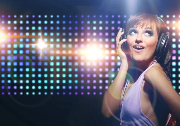 Portrait of a young dancing girl in headphones — Stock Photo, Image