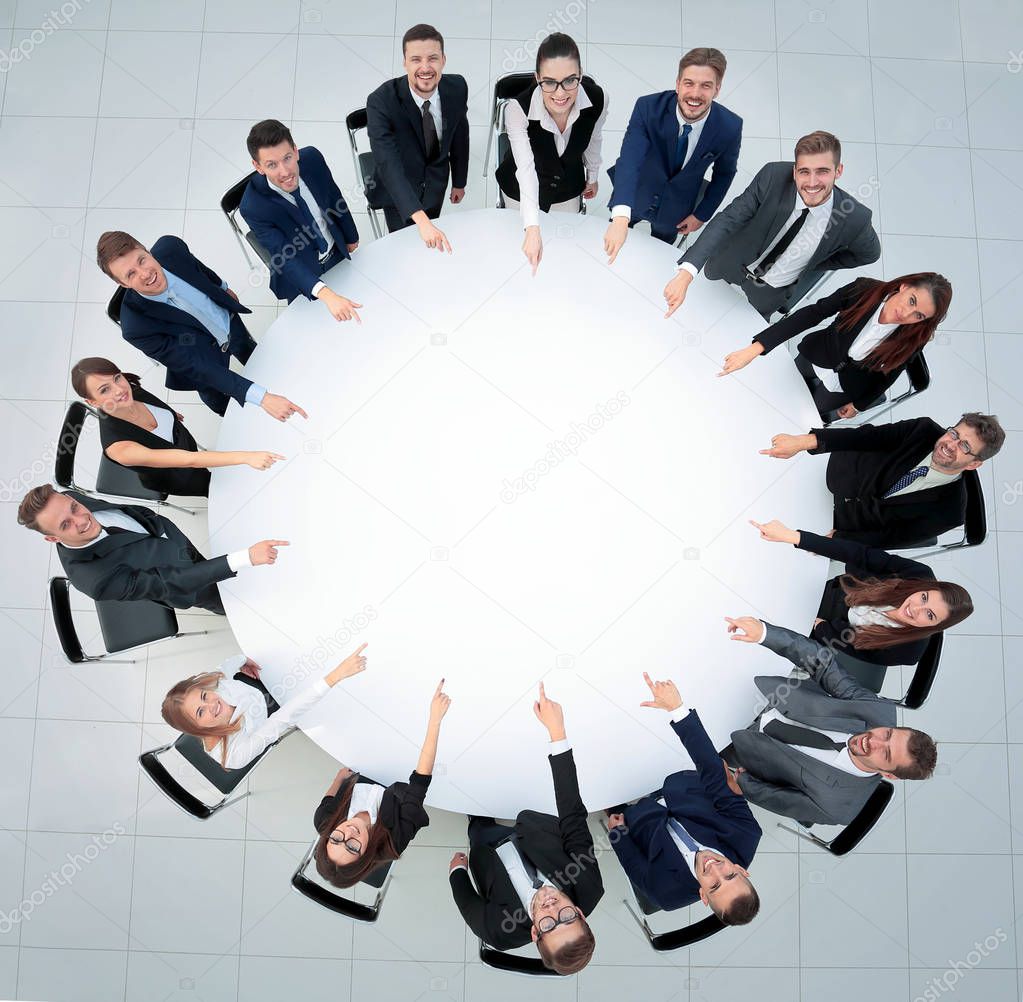 Business team, sitting at athe round table on white background.