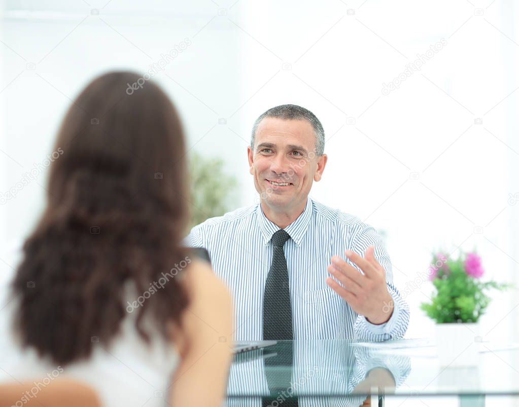 qualified lawyer talking to client in a modern office