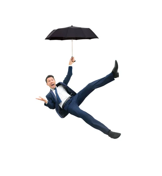 傘を保持し、白い背景の上を飛んでの実業家のイメージ — ストック写真
