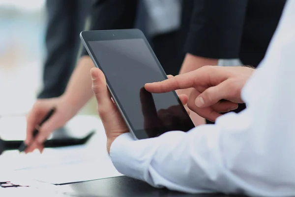 Businessman holding digital tablet at meeting — Stock Photo, Image