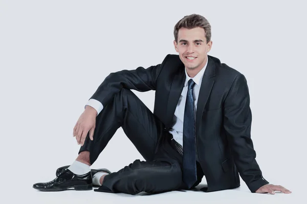 Бізнесмен сидить ізольовано на білому тлі — стокове фото