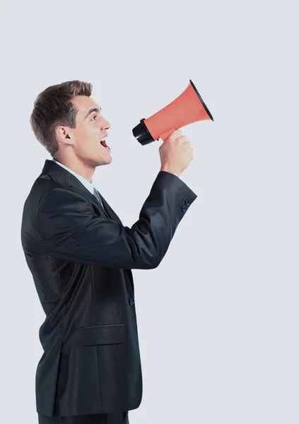 Business man screaming loudly in a megaphone — Stock Photo, Image