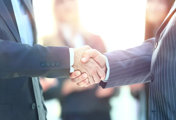 Business handshake. Business man giving a handshake to close the deal — Stock Photo, Image