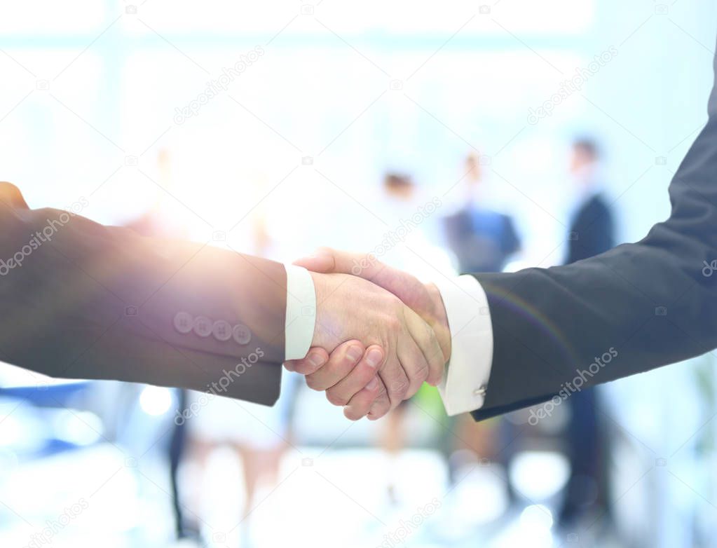 Business man shaking hand to partner