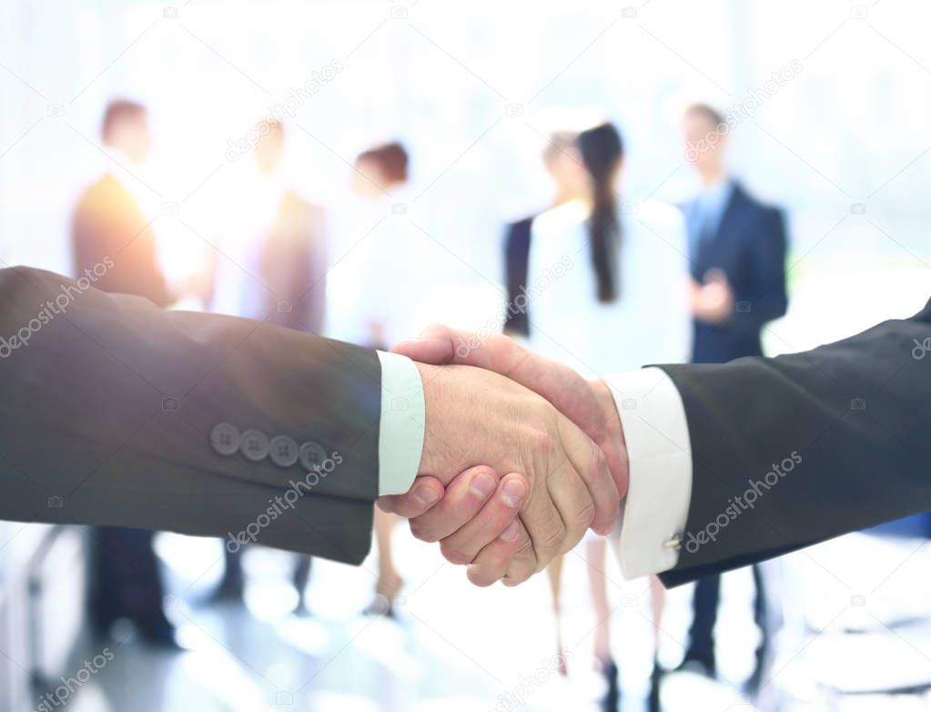 Business man shaking hand to partner