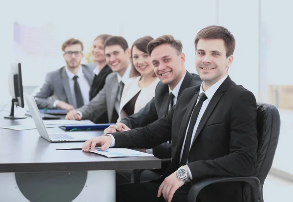 Companys shareholders at the meeting sitting behind a Desk with — Stock Photo, Image