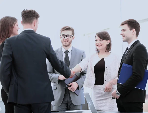 Business partners shake hands before signing the contract in the — Stock Photo, Image