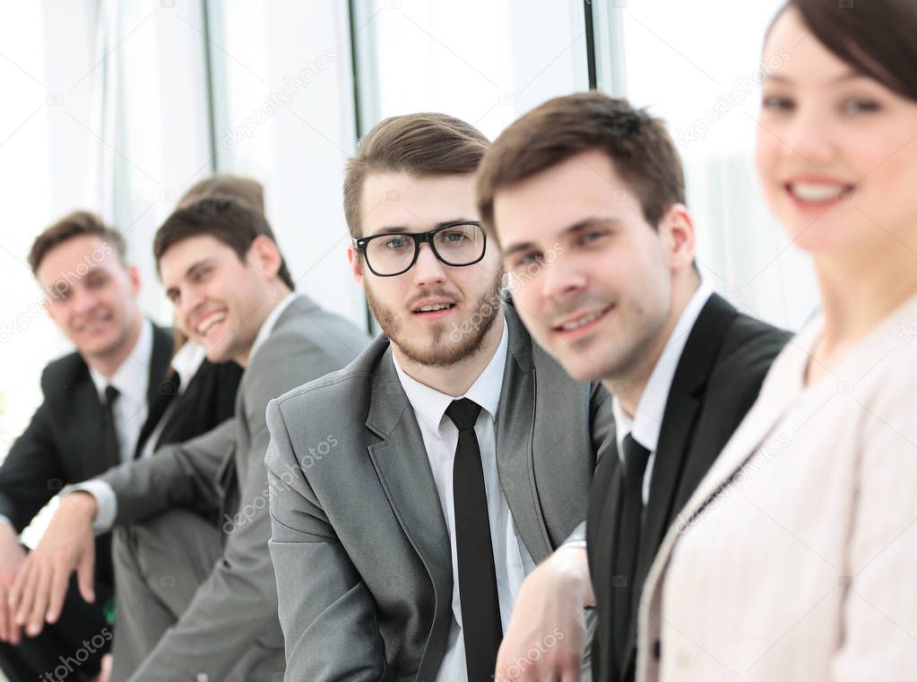 business team and beautiful woman administrator in the lobby of