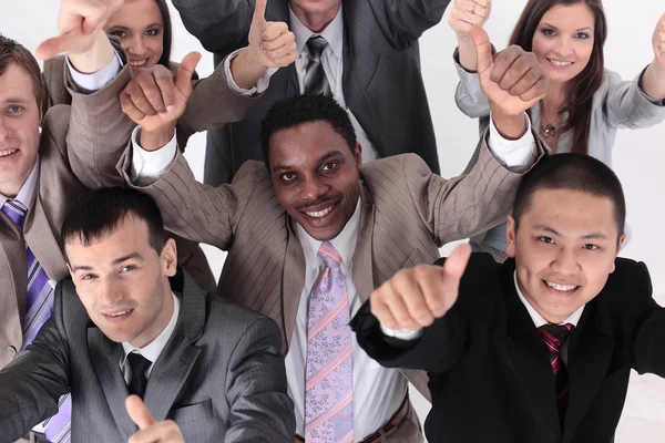 Happy business people cheering and showing thumb up at office — Stock Photo, Image