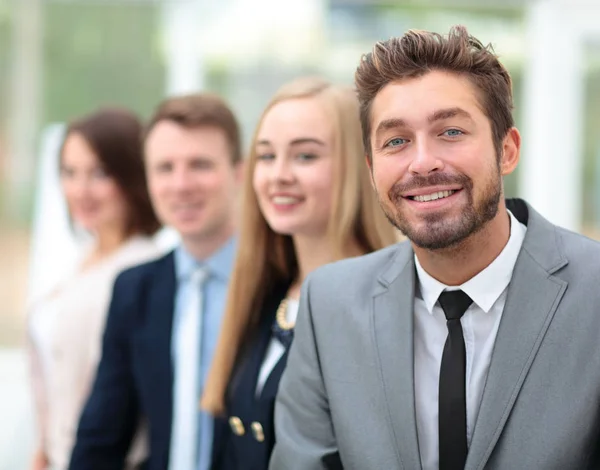 Eleganta medarbetare titta på kameran under mötet i office — Stockfoto