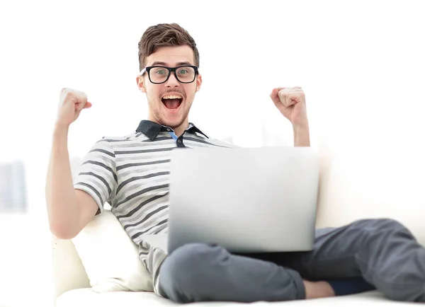 Man Relaxing on Sofa with Laptop Computer — Stock Photo, Image