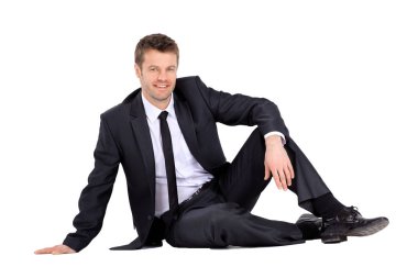 Katta oturan işadamı gülümseyen