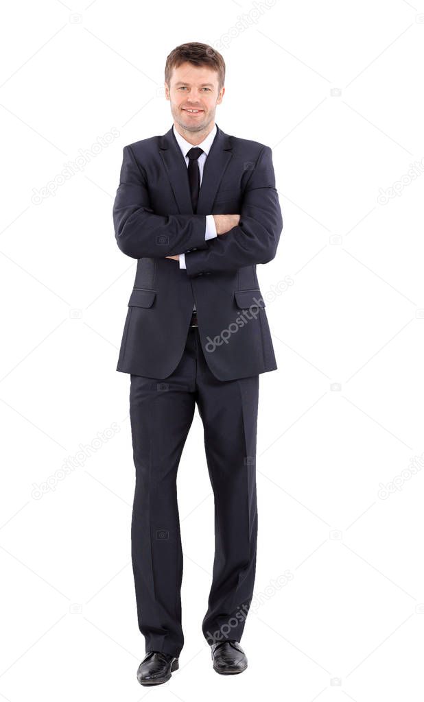 Portrait of a handsome business man  in suit smiling with arms