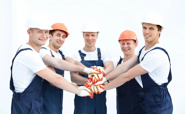 Equipe de construtores unindo as mãos em círculo — Fotografia de Stock