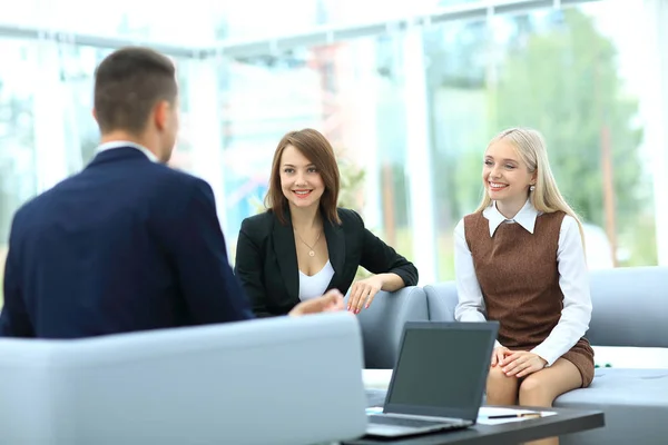 Successful businessteam of three sitting in office and planning — Stock Photo, Image