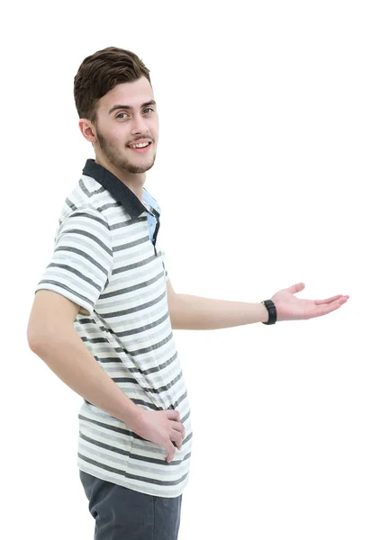 Šťastný mladý muž zobrazeno prázdné copyspace na bílém pozadí — Stock fotografie