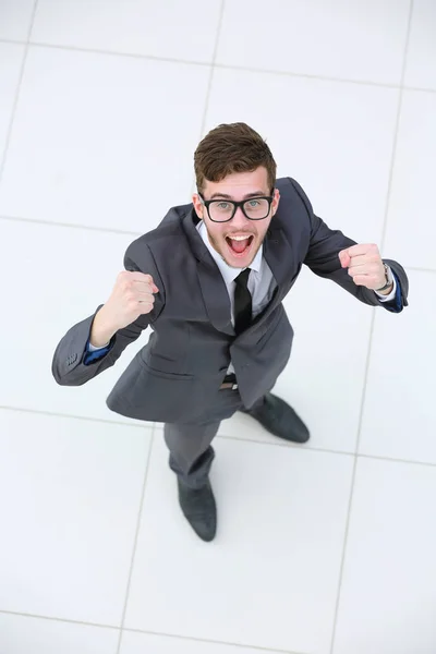 Cheering businessman with his arms raised up on white background — Stock Photo, Image