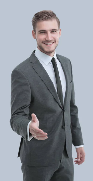 Portret van een elegante knappe zakenman op grijze achtergrond. — Stockfoto
