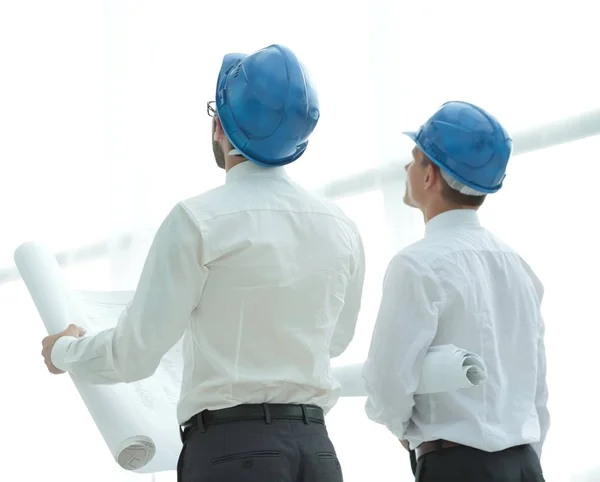 Rear view.architect and Builder looking at blank screen — Stock Photo, Image