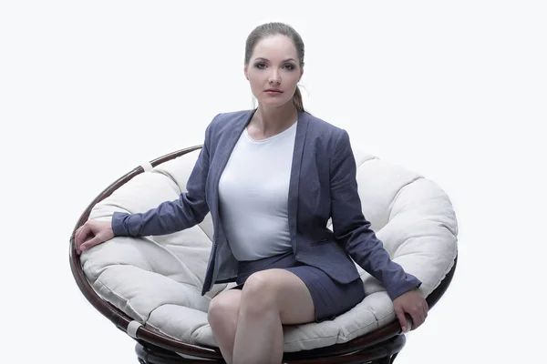 Business woman sitting in a round chair rattan — Stock Photo, Image