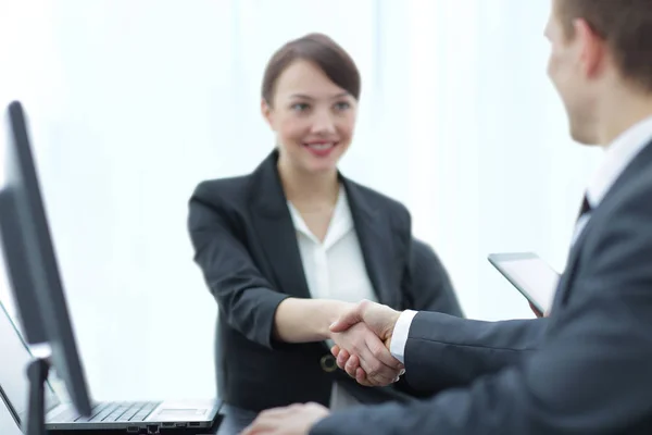 Modern pretty business woman  shaking hands in a bright  office — Stock Photo, Image