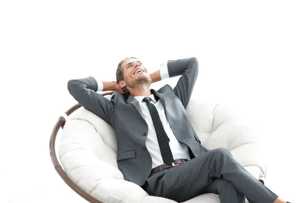 Jovem homem de negócios meditando em grande poltrona confortável — Fotografia de Stock