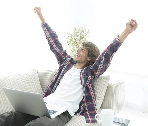 Happy young man looking at laptop screen — Stock Photo, Image