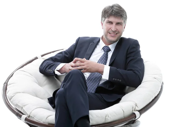 Framgångsrik affärsman sitter i en mjuk bekväm stol. — Stockfoto